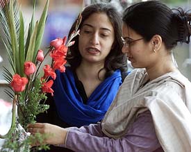 Girls buying flowers for Valentine Day